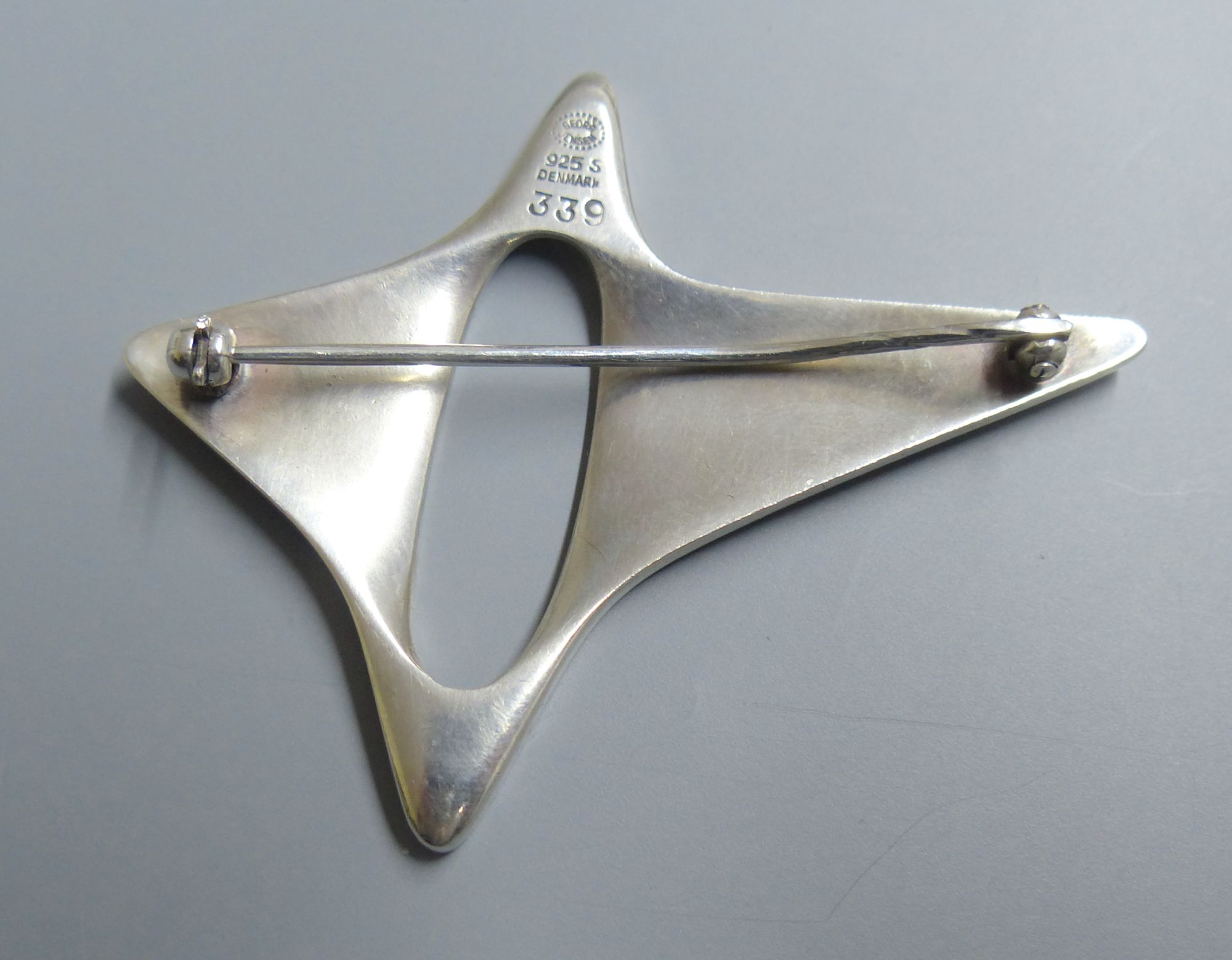 A Georg Jensen sterling abstract brooch, designed by Henning Koppel, no. 339, 57mm.